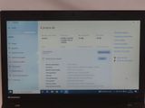 laptop computer sitting on a table with a keyboard and mouse in front of it