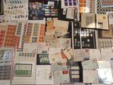 a lot of stamps and envelopes on the table