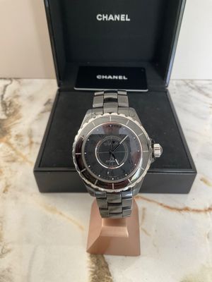 a close up of a watch in a box on a table