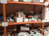 many boxes and boxes on the shelves in the room