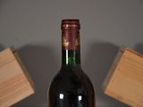 a bottle of wine that is sitting on a table