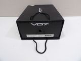 a close up of a black box on a white surface