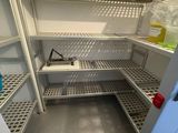 a refrigerator that has a lot of shelves in it