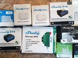 several boxes of electronics sitting on top of a wooden table