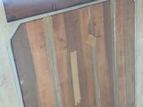 a picture of a bathroom with a toilet and wood paneled walls