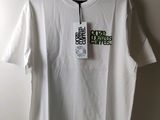 a white t - shirt with a tag on it hanging on a hanger