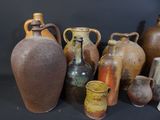 many vases that are sitting on a black surface