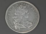 a close up of a coin with a woman ' s head on it