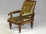 fauteuil en bois et en cuir, avec accoudoirs et pieds