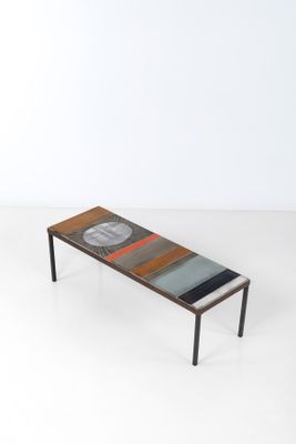 an image of a coffee table with a glass top and metal legs