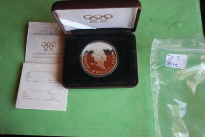 a small box with a coin in it on a table