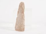 a stone object that is sitting on a white surface
