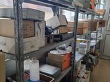 many boxes and boxes on the shelves in the room
