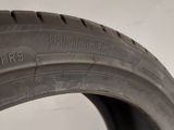 a close up of a tire on a white surface