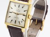 an image of a wrist watch with a brown leather band