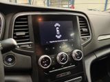 a picture of a car dashboard with a radio and steering controls