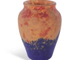 a vase that is sitting on a white surface