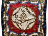 a red, white and blue scarf with a gold and blue design