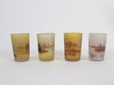 three shot glasses with a picture of a landscape on them