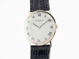 a close up of a wrist watch with roman numerals on it