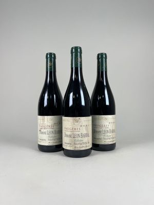 three bottles of wine sitting next to each other on a table