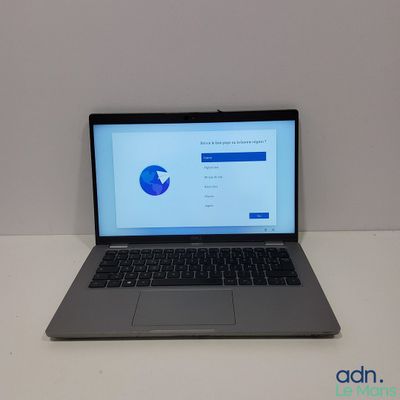 an open laptop computer sitting on top of a white table