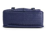 a blue leather bag with a handle on a white background