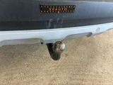 the rear end of a car with a sticker on it ' s bumper