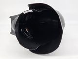 a close up view of a camera lens on a white surface
