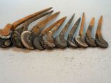 many different types of hammers on a white surface