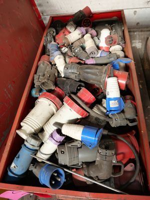 a red box filled with assorted electrical tools