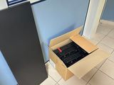 a box that is sitting on the floor in front of a window