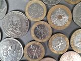 a lot of coins that are sitting on a table