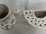 two vases that are sitting next to each other