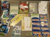 a table that has a lot of stamps and postcards on it