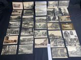 many old postcards of different types and sizes are on a table