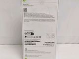 the back of a white box with a green label on it