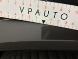 a close up of a sticker on a car ' s front bumper