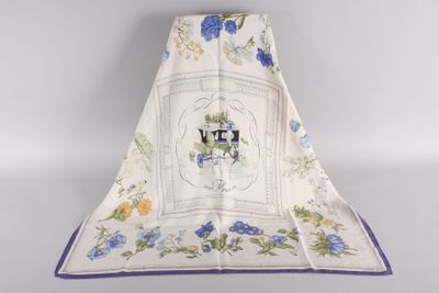 a white towel with blue flowers and a picture of a cat on it