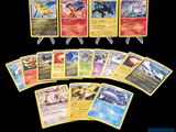 a lot of pokemon cards on a black background