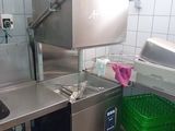 a kitchen with a sink and a dishwasher in it