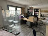 a glass display case in the middle of a room