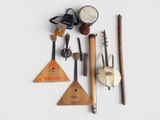 several musical instruments are arranged on a white surface