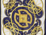 yellow, blue, and white square scarf with a design of bicycles