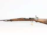 a rifle with a wooden barrel on a white background
