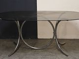 a black table with a glass top in a room