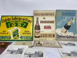 many different types of advertising signs on a table