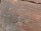 a close up of a piece of wood that has been damaged