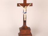 an antique wooden crucifix with a cross on top of it