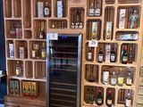 a display of liquor bottles and bottles in a store